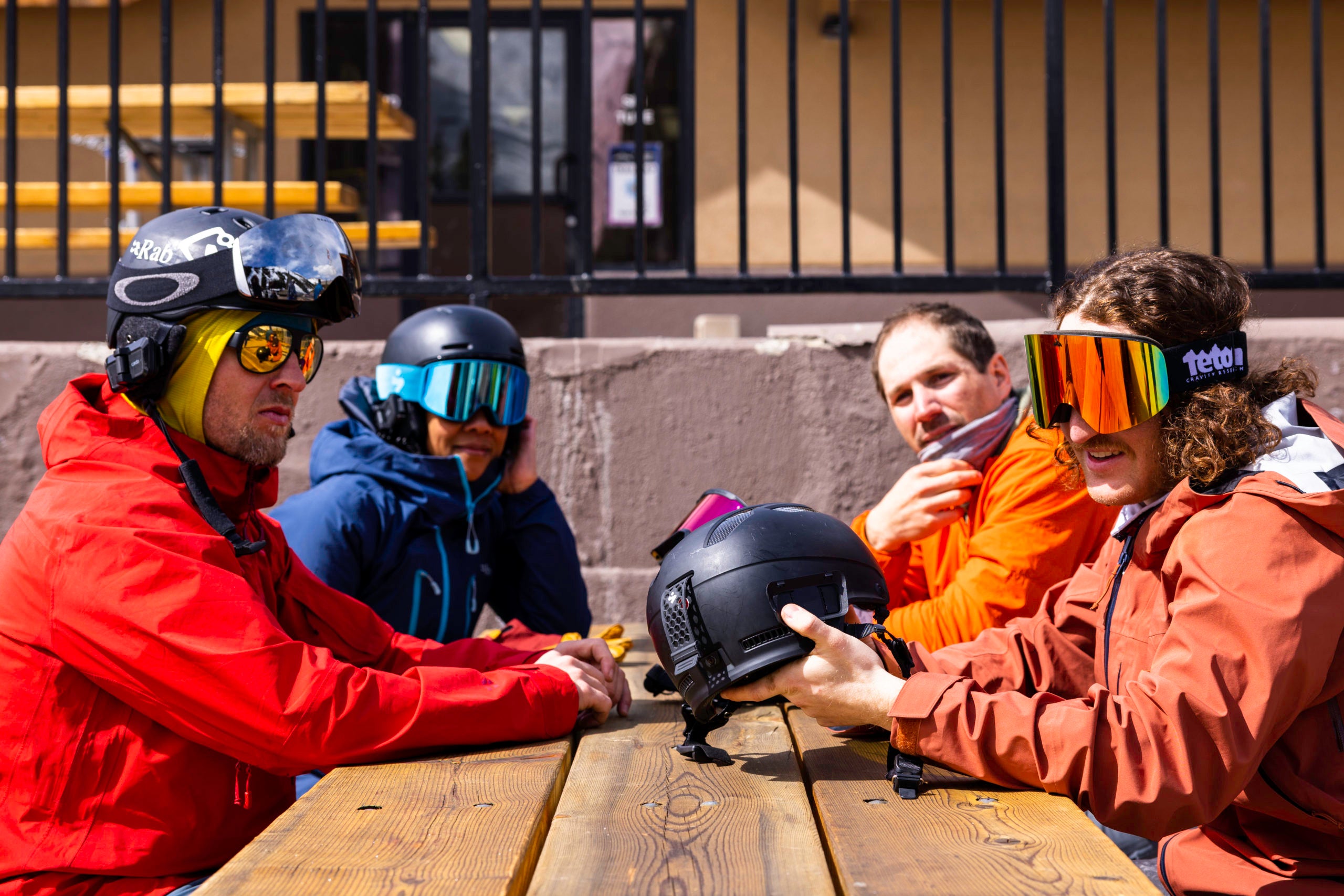 Cardo systems NZ | Packtalk outdoor shown on a table at a ski feild